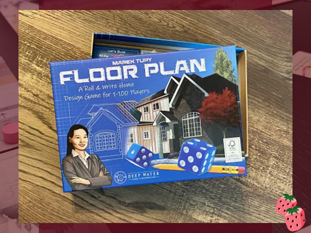 The Floor Plan board game box by Deep Water Games shown on a wooden table, featuring blueprint-style artwork, dice, and a house illustration.