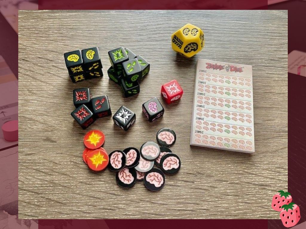 All of the Zombie Dice components are shown including, dice, score pad and tokens.