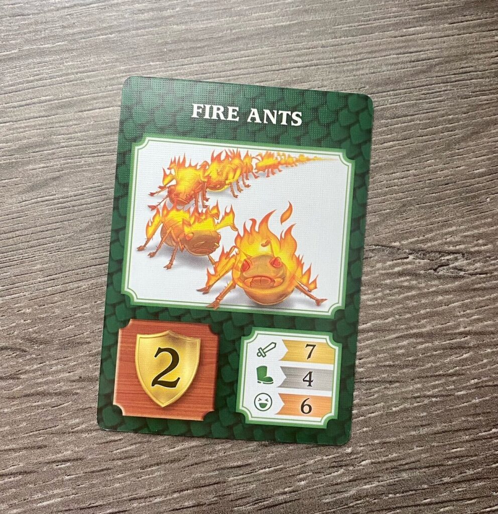 A game card showing Fire Ants if pictured. Some numbers for different stats show at the bottom of the card.