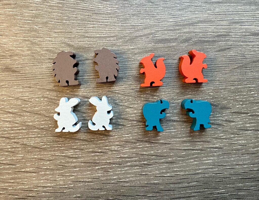 woodland creature meeples in the shape of a porcupine, squirrel, mouse and turtle. 