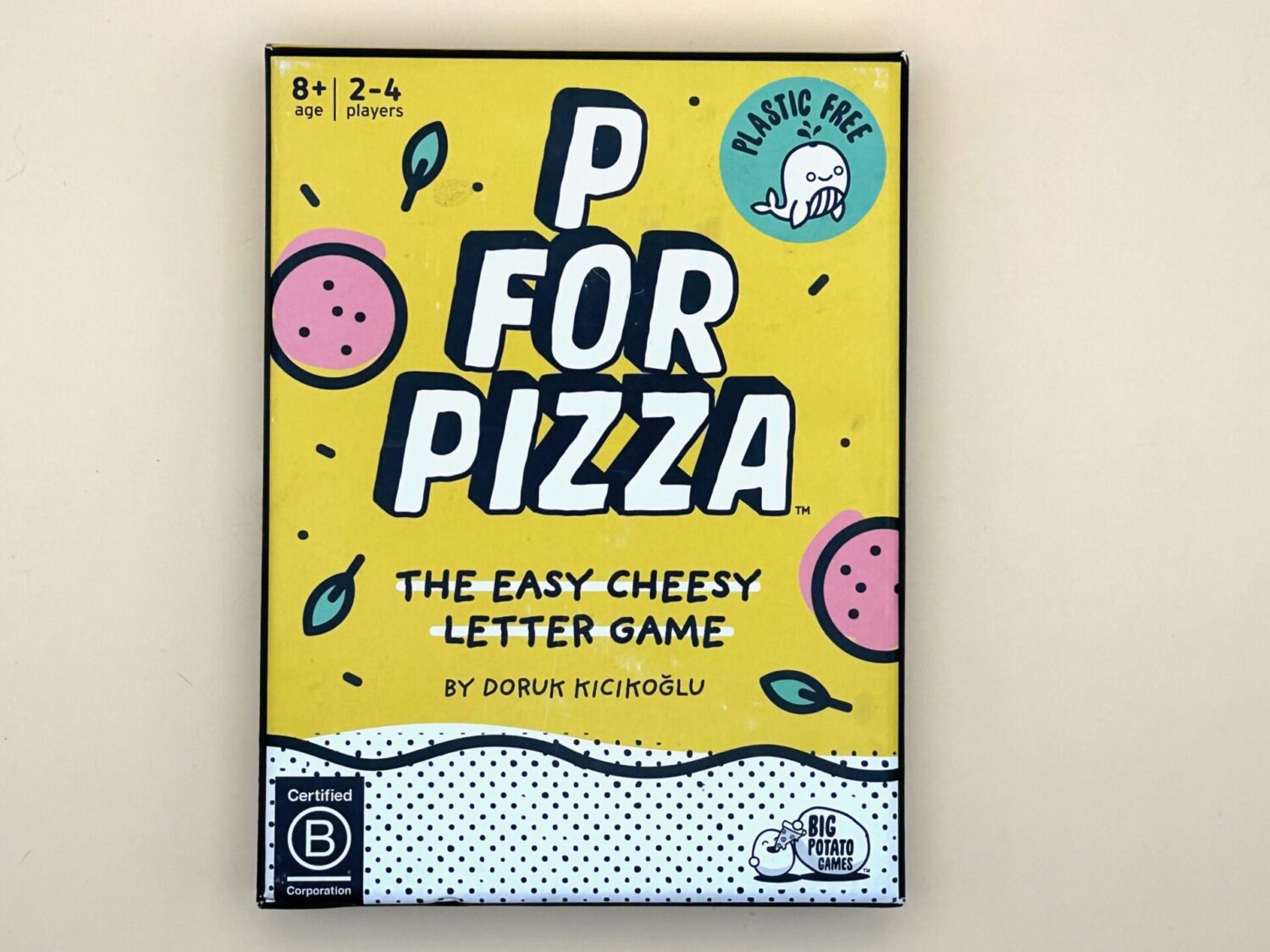 The game box cover for P for Pizza is shown. The box reads The easy, cheesy letter game.