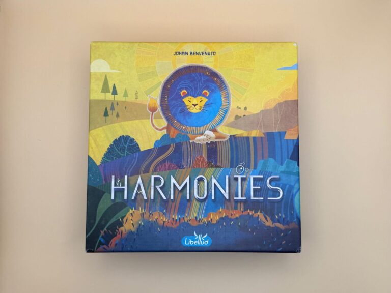 A game board box shows a lion on the front over the words Harmonies. The Libellud logo is pictured in the bottom center.